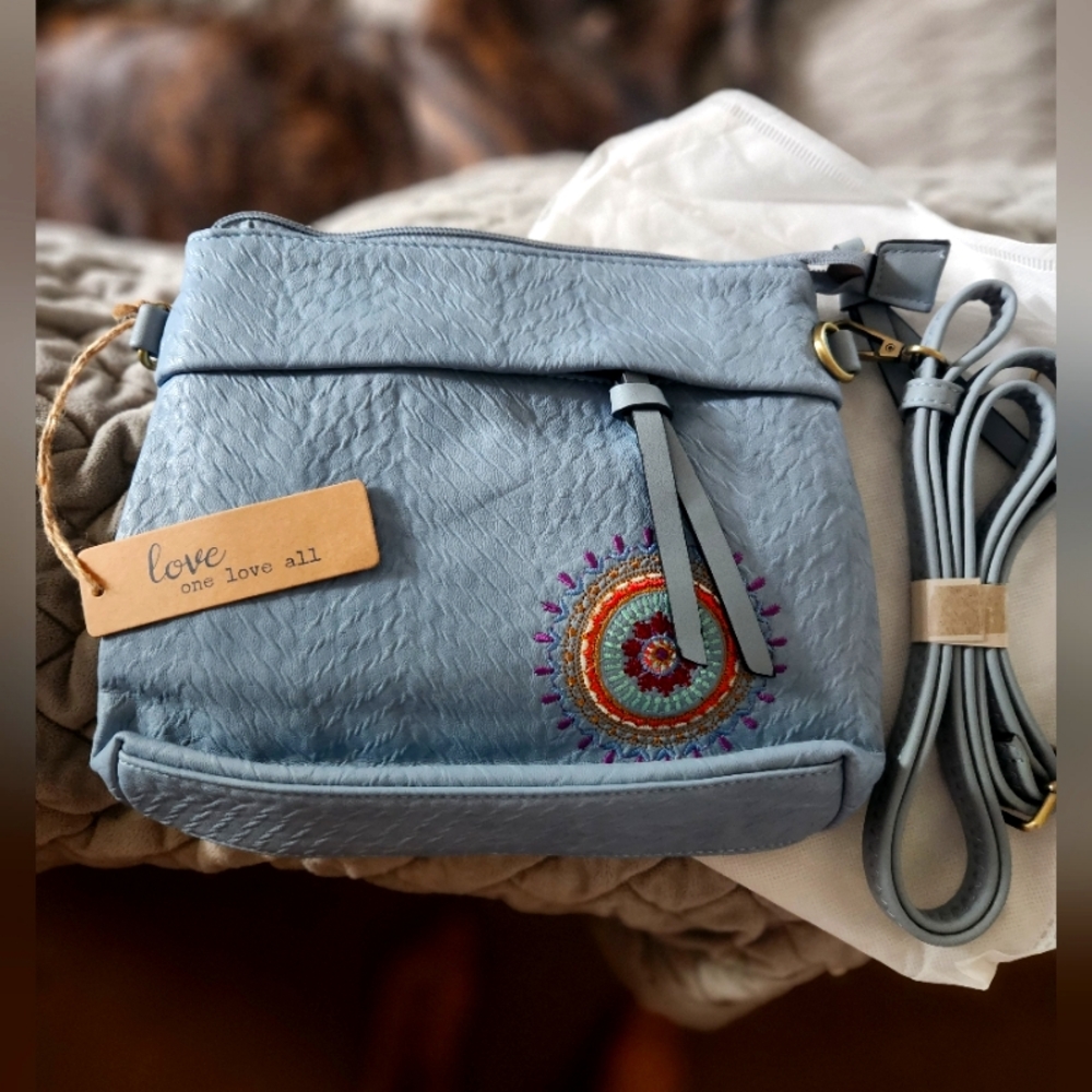 Love one love all crossbody. Bnwt really cute, soft material